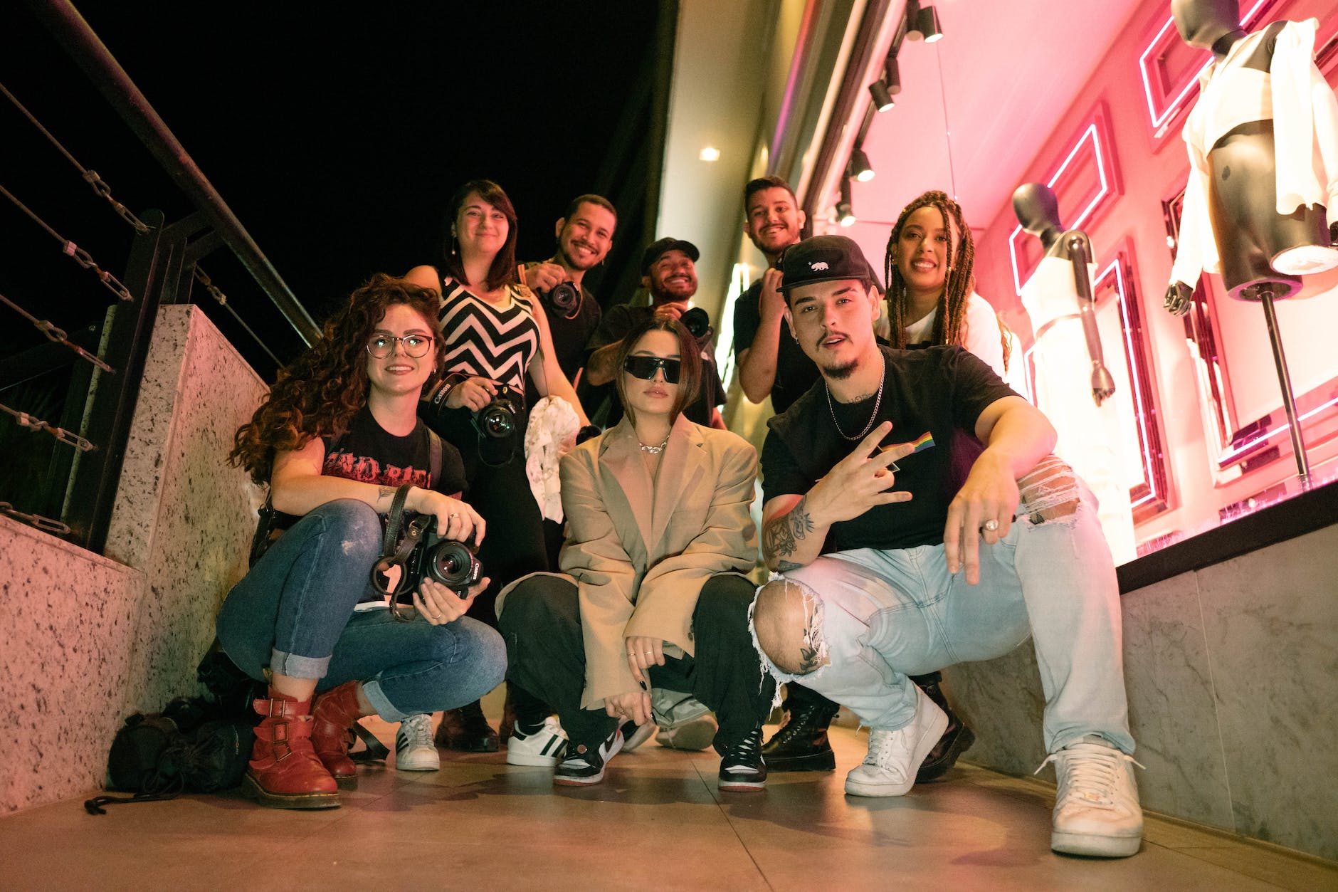 friends posing together at night